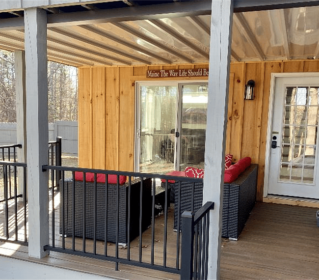 Covered deck, stairs to yard and fire pit.