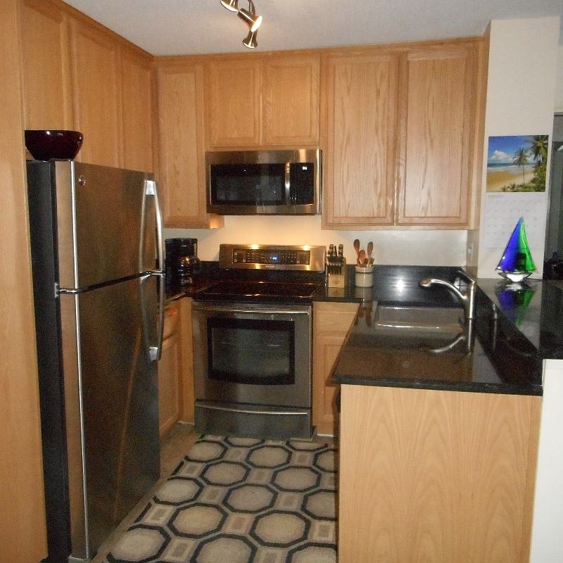 Newly remodeled kitchen with all new appliances, counters and oak cabinets.