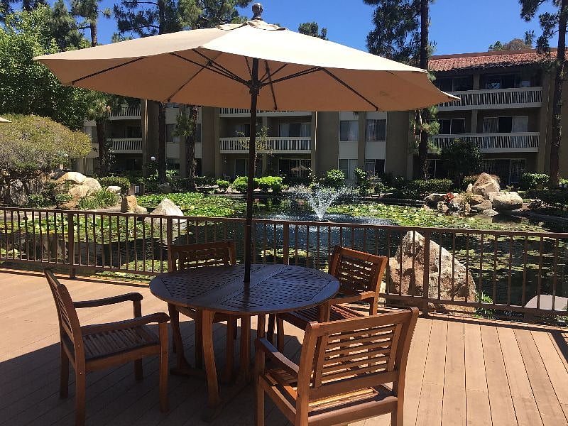 Duck and fish pond surrounded by patios.