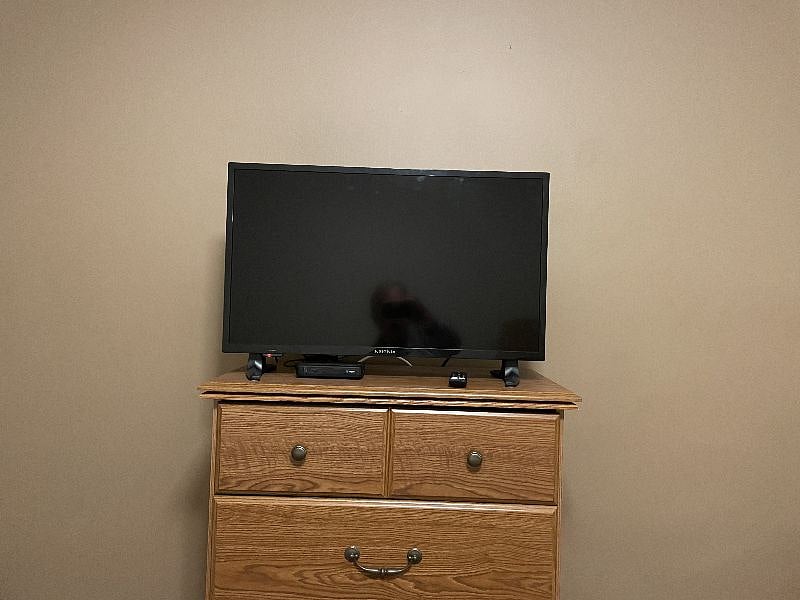 Bedroom Smart TV with over 200 Direct TV channels.