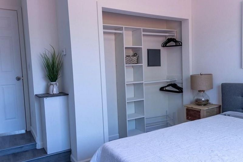 Bedroom closet, it has extra space above the closet for storage.