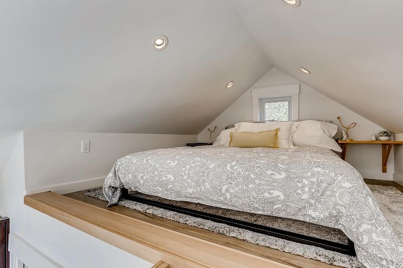Loft furnished with a queen-size bed.