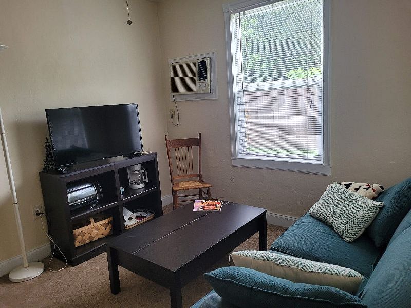 Living room with 42" smart TV and a comfy couch