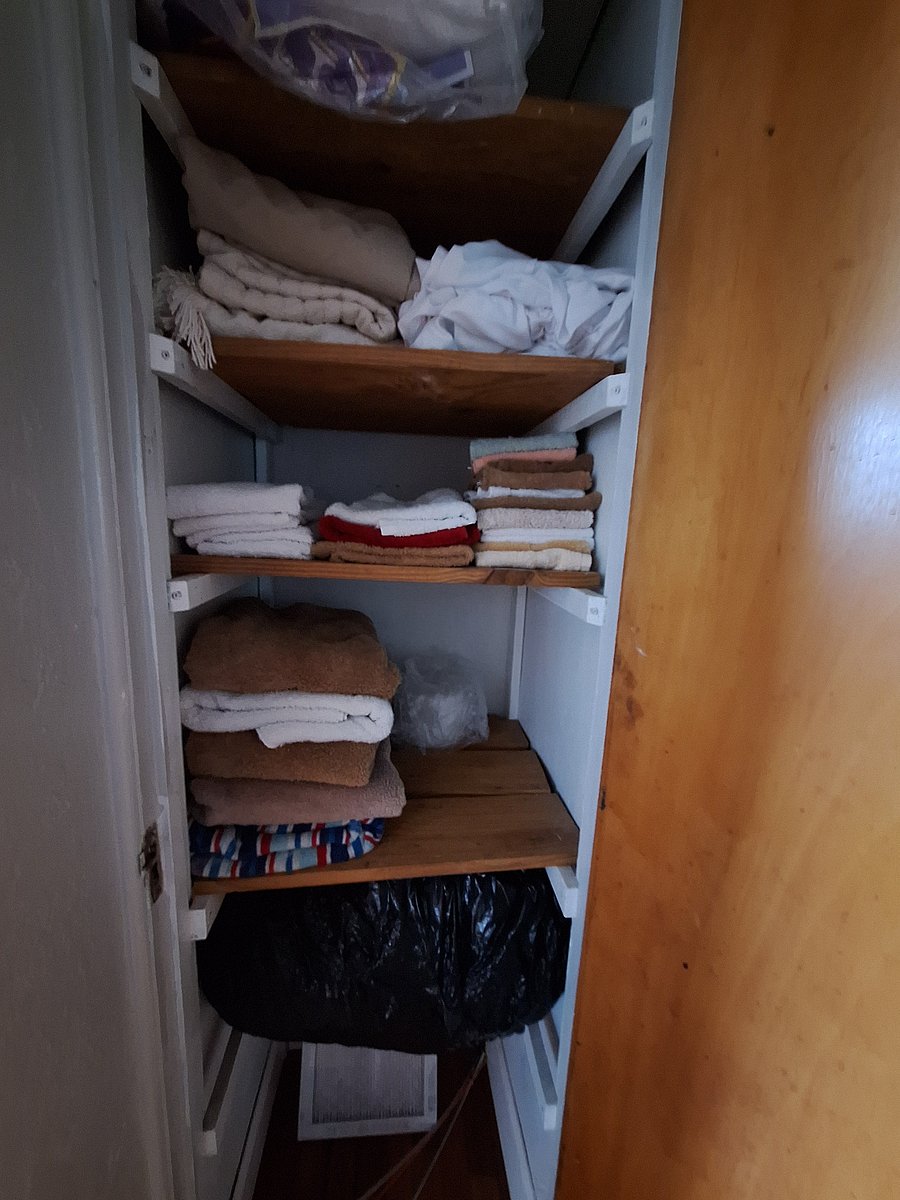 Linen closet with extra towels and sheets.