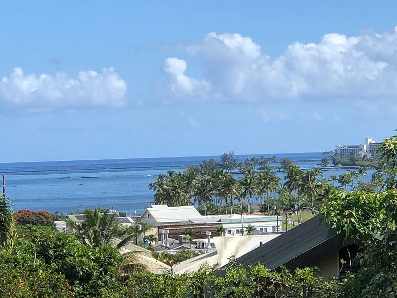 Beautiful Kona Bay, where you can swim, surf, join our Kai O Pua outrigger canoe club or fish off the pier.