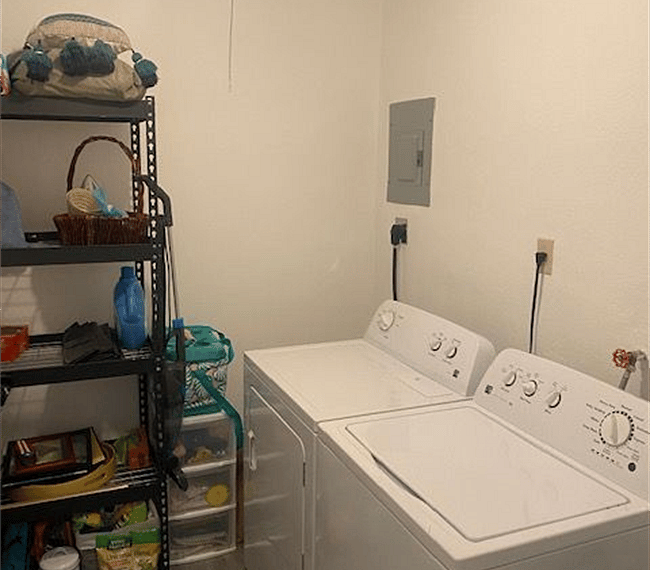 Laundry room, full size washer & dryer. Shelving for storage
Beach towels & totes located here.