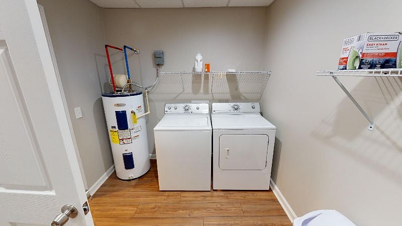Laundry room shared with other unit but separated by locked doors.