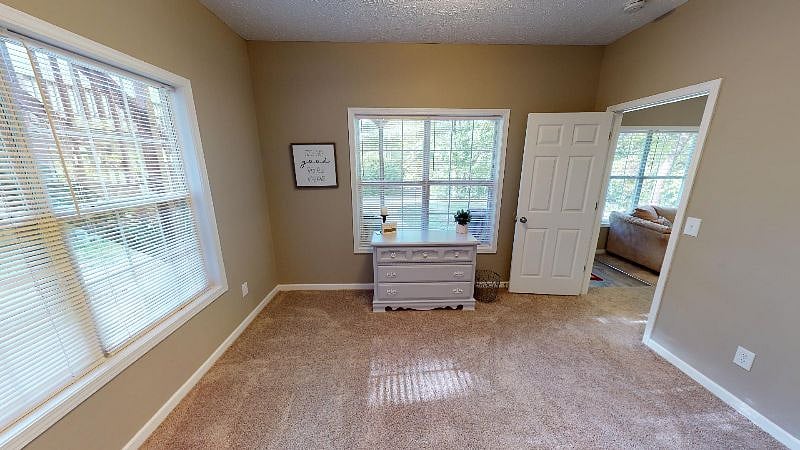Unit B Bedroom 1 has lots of windows. Light and airy