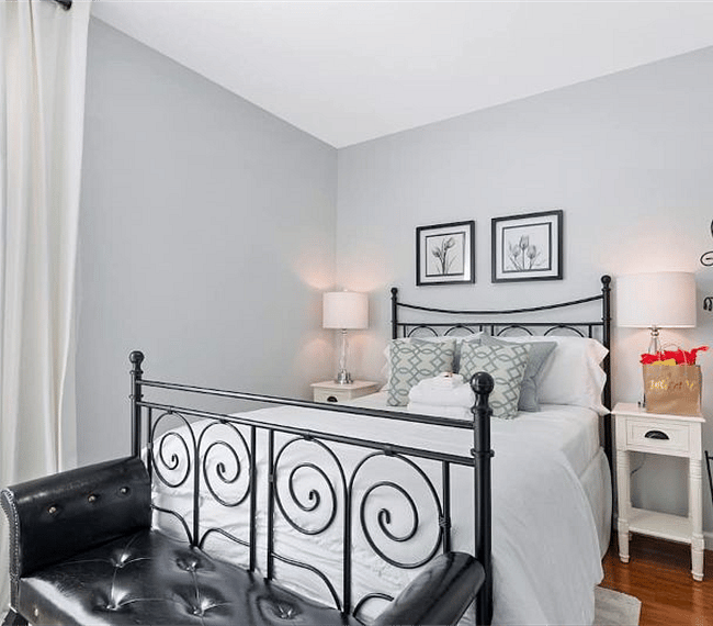 Gorgeous bright bedroom with a queen-size bed.