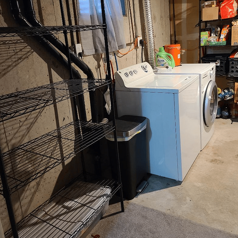 empty basement shelves for gear in laundry room
