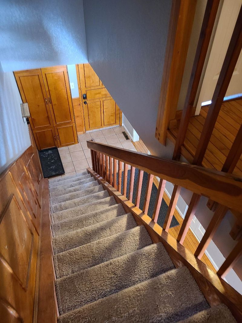coat/shoe cabinets at front door and at top of stairs
