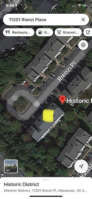 1 dedicated reserved parking space in front of the Condo and Visitor Parking across from Condo with two free parking passes displayed.