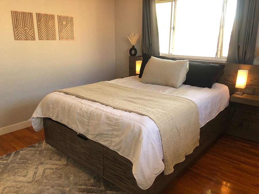 Queen sized bed on a custom made bed frame. High quality pop-out drawers for extra storage in the bed frame, along with nightstands. Bed is a low-tox Nectar mattress.