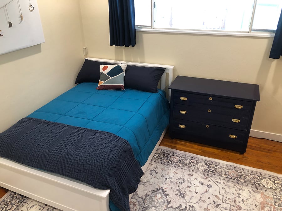 Office/Secondary Bedroom. 

Full sized bed with a pillow-top mattress + a twin trundle underneath. (Desk catty corner to the bed.)

Full sized closet. 