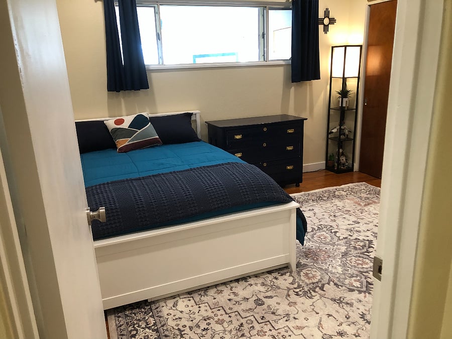 Flexible space designed for work or rest, featuring a desk, full-size bed, and twin trundle for guests.