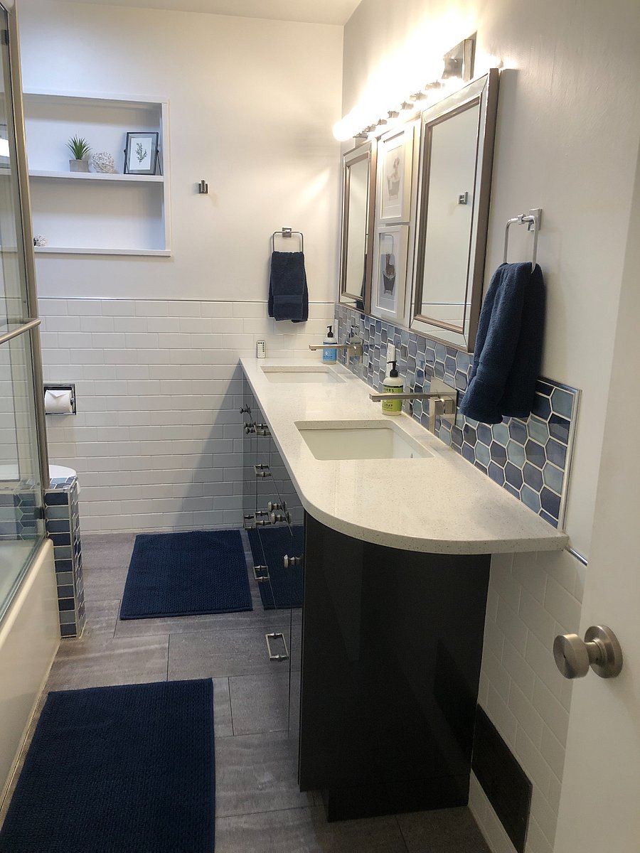 Main bathroom in the hallway between the two bedrooms. Rain shower option, new bathtub, and no-slam cabinets. 

Bathroom (and hallway) have built-ins for extra storage. 