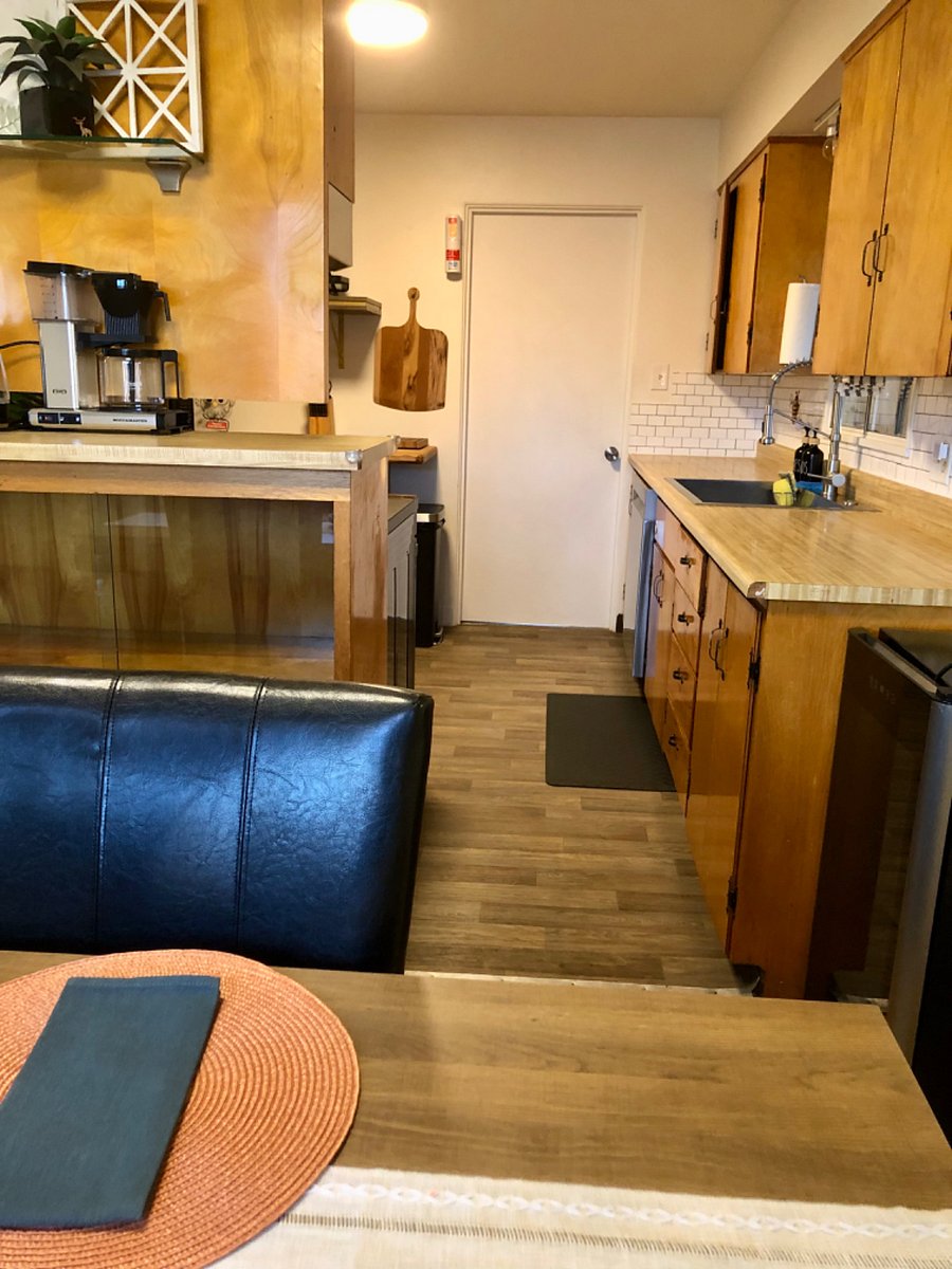 Coffee and tea nook with the liquor, storage, or game cabinet underneath. 