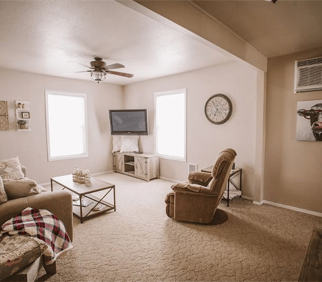 Cozy living room with beautiful furniture and a TV.