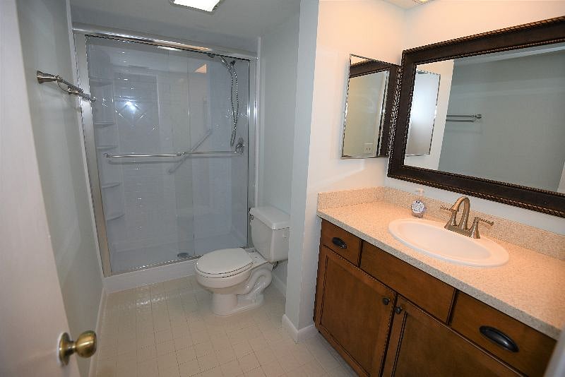 Remodeled master bathroom with Corian counter tops.