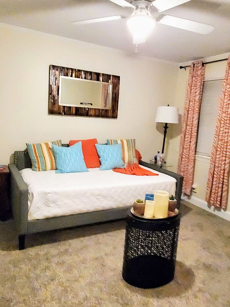Daybed couch in swoerate ouvhng room is very comfy for watching TV. And qith a closet and a door that closes, this room can double as a 2nd bedroom for a 2nd tenant or overnight visitor.