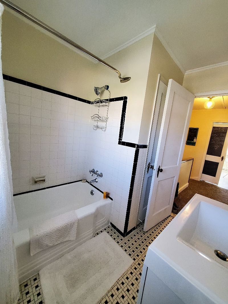 Tiled shower/tub combo is perfect for relaxing after a long day... whether you are a bath or shower person!
