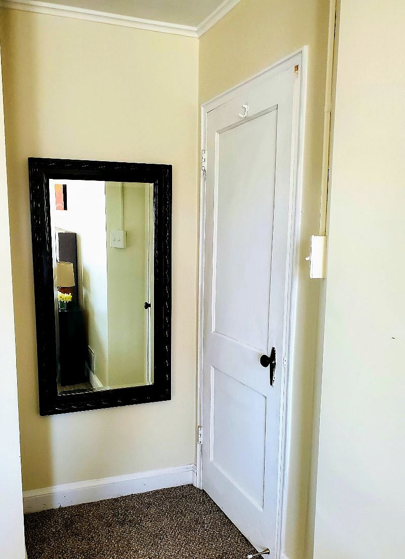 Large mirror in bedroom... perfect for getting ready for a night out in Charm City.