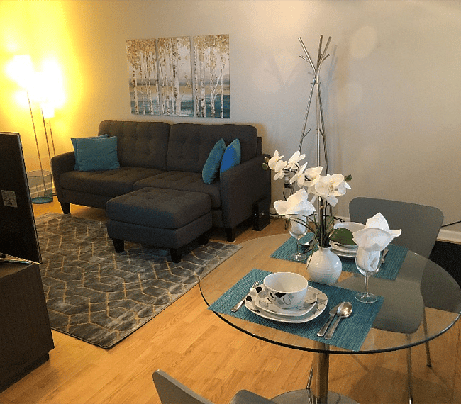 Open and flowing floor plan with all newer modern furnishings,decor and beautiful light wood floors.