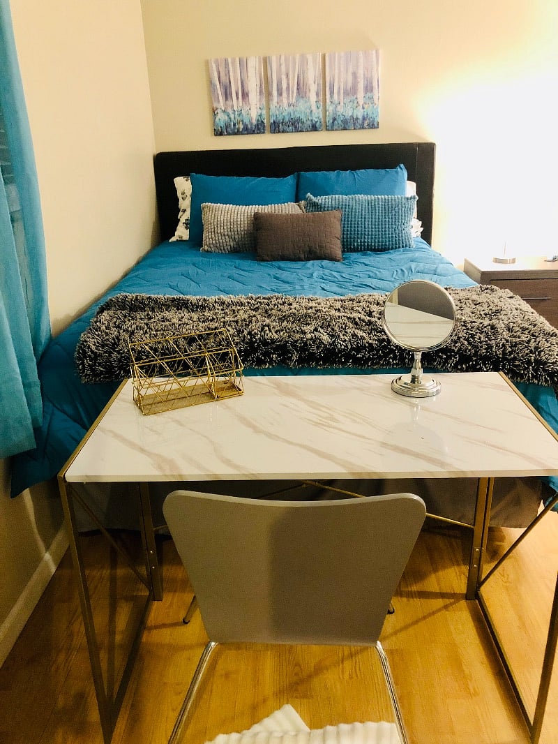 The collapsible desk also doubles as a vanity. Keep it out or tuck in away in the extra large closet according to your needs.