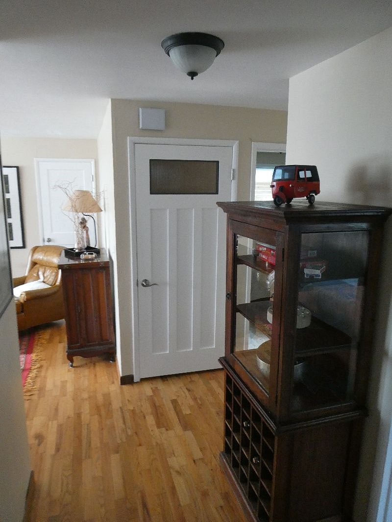Entrance door at top of stairs.