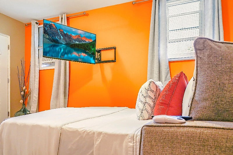 Lay in bed and watch your favorite movie on the swivel Smart TV