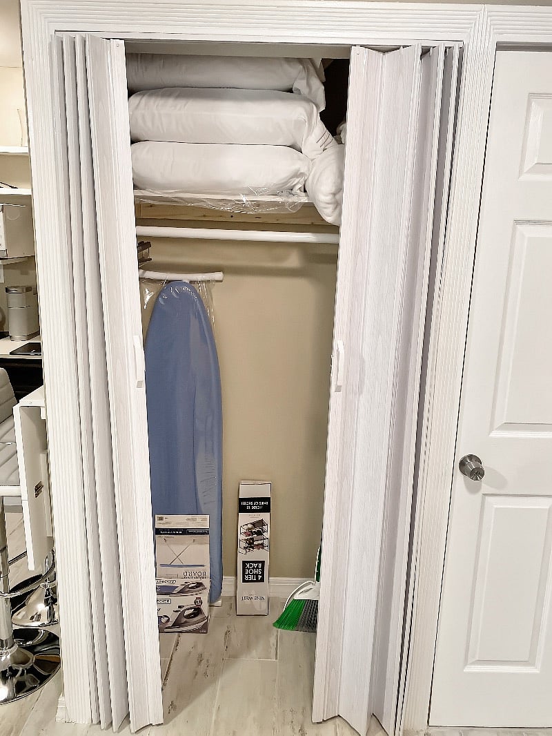Storage closet with mop, broom & dustpan, and stiffer wet jet
