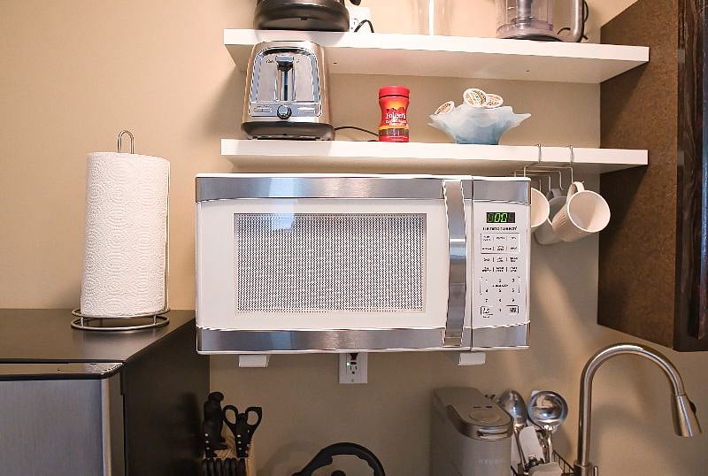 Microwave, toaster, Kuerig coffee maker w/ starter K-cups, coffee pot, coffee cups And paper towel rack