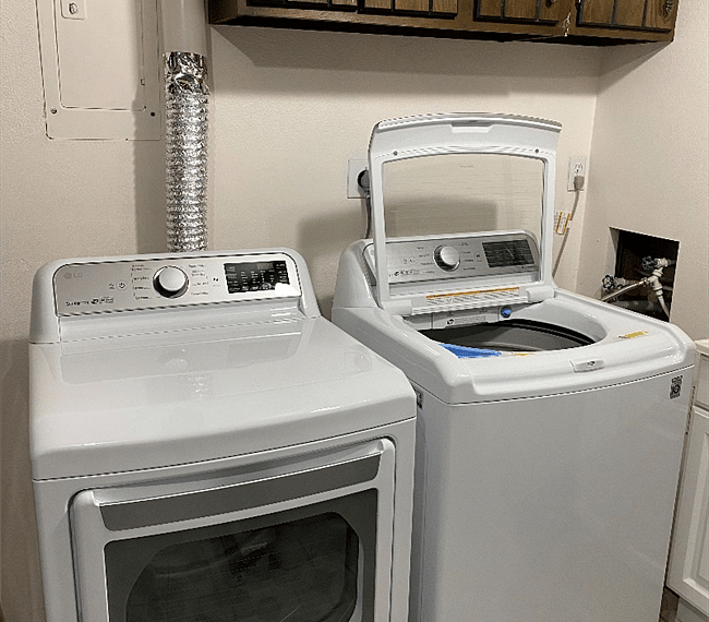 New model washer and dryer extra storage in laundry room