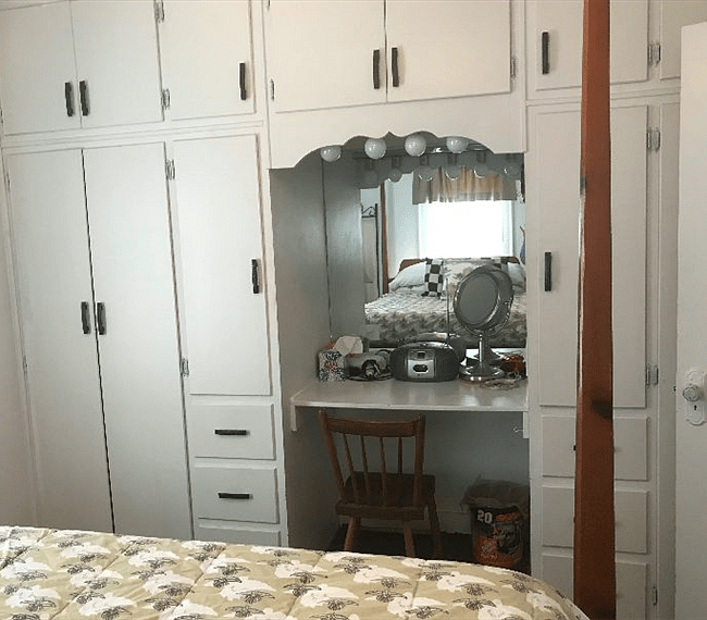Built-in cabinets and a small make-up area in the bedroom make getting ready for work a breeze.