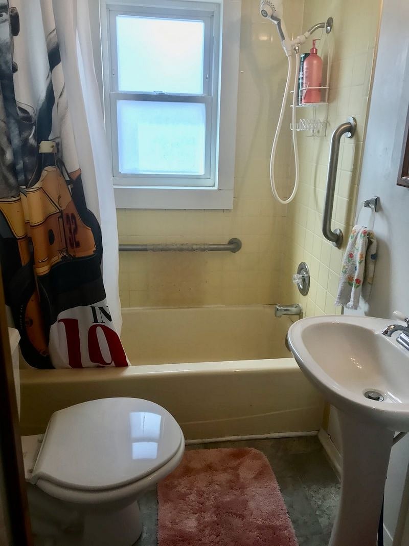The combo tub/shower has a hand-held shower massage.