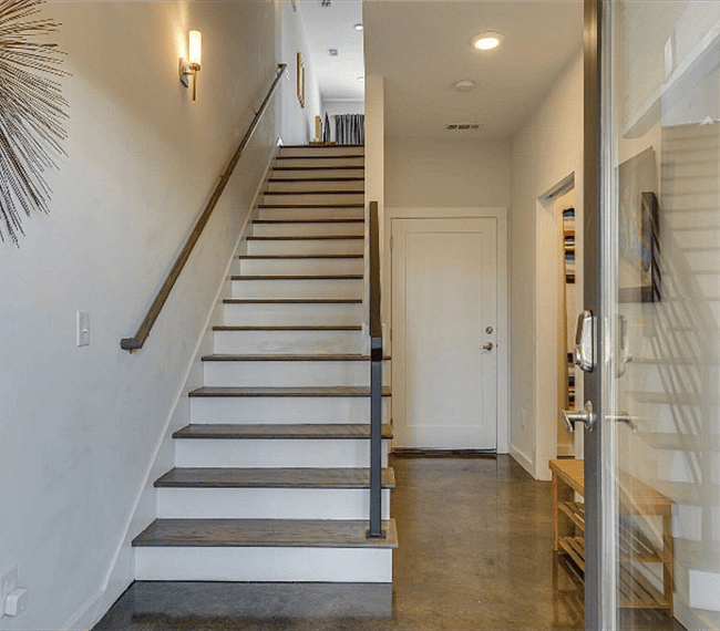 Stairs from the entry. Office, closet and garage access.
