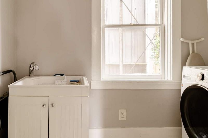 Laundry room with new washer and dryer
