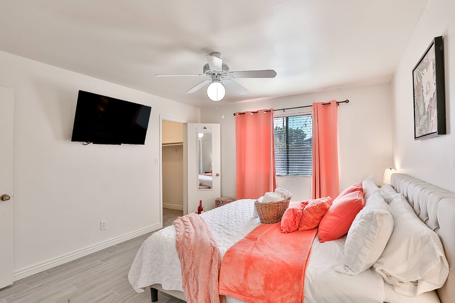Master Bedroom with a wall mounted TV