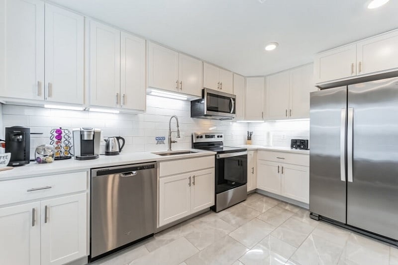 Kitchen with Stainless Steel Appliances and 2 Coffee Machines