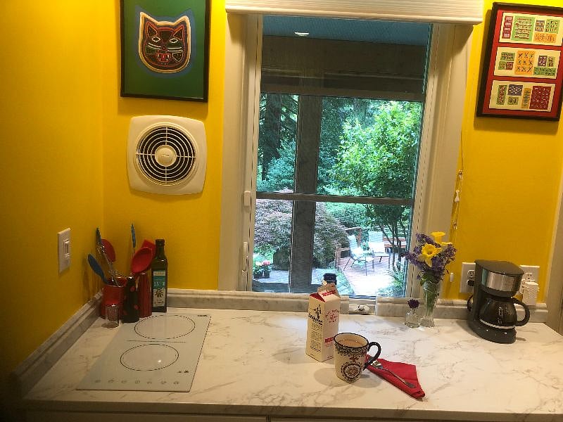 Here's that view again! Window wall includes cooktop, fan, coffeemaker and alarm key pad.