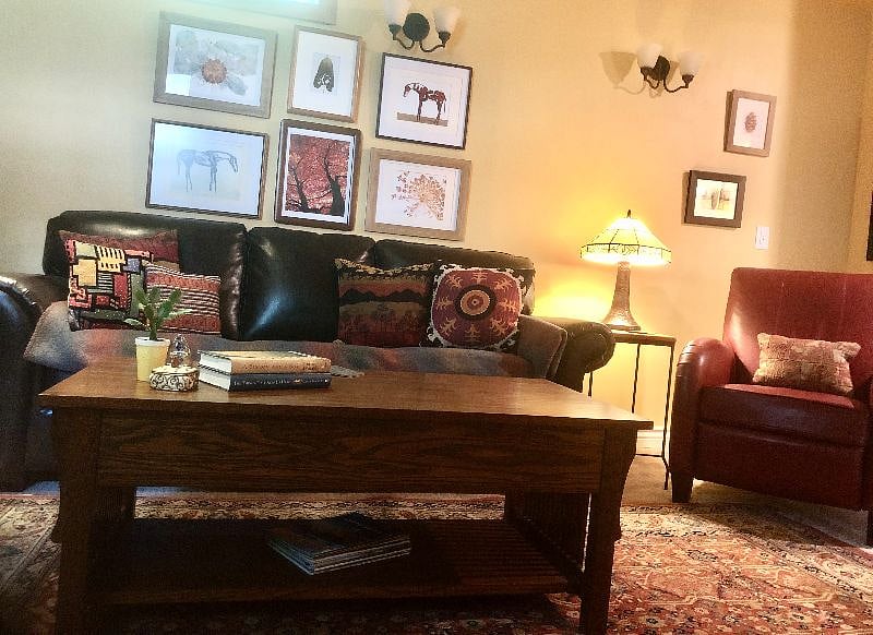 Overhead lighting, wall sconces and lamp for easy reading.