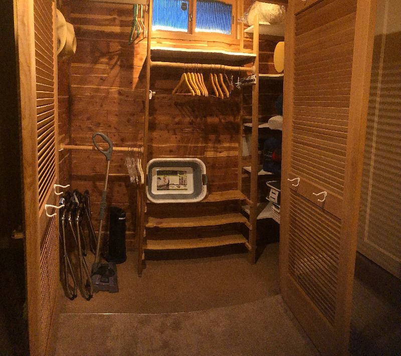 Double-door cedar closet: luggage racks, portable vacuum, collapsible laundry basket, blankets and two sets each of flannel and bamboo-cooling sheets + organic cotton summer sheets.