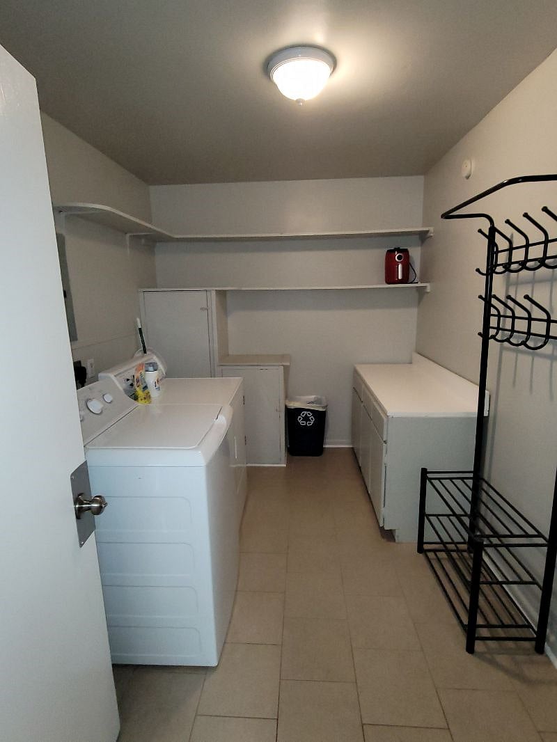 Larger Wash Room with an area to fold and sort laundry. 
