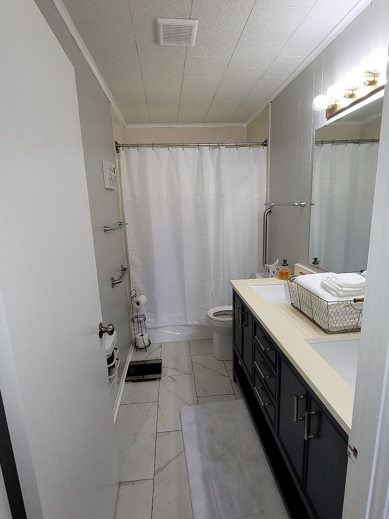One bathroom with double sinks.