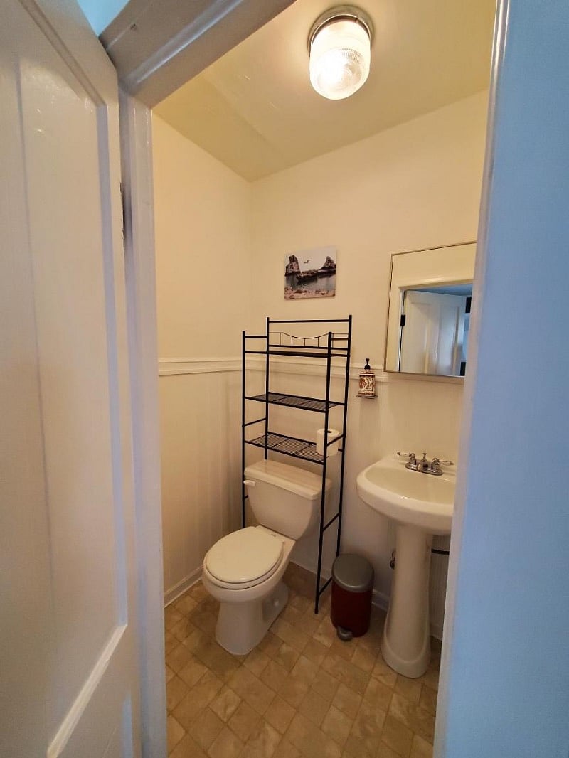 En suite bathroom/powder room in bedroom.