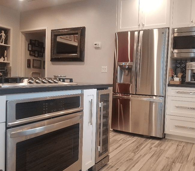 Oven, stove, wine refrigerator on island