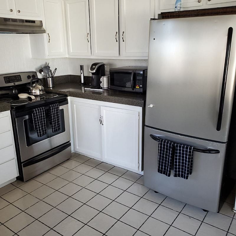 Fully appointed kitchen, featuring stainless steel appliances 