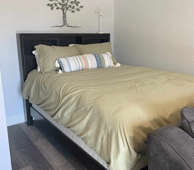Queen size bed with storage in headboard