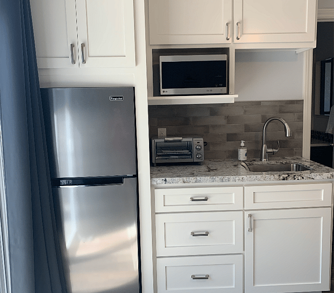 microwave, toaster oven, hotplate in cabinet