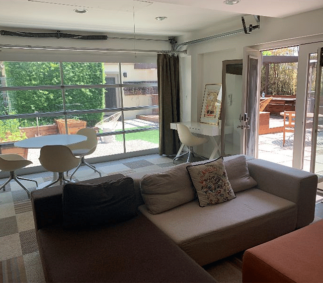 While there is a lot of natural light, one can close all the blackout curtains for privacy and for sleeping. The big window is low-e triple insulated and the french door windows are double insulated so the studio is very quiet. The french door windows open up for fresh air.